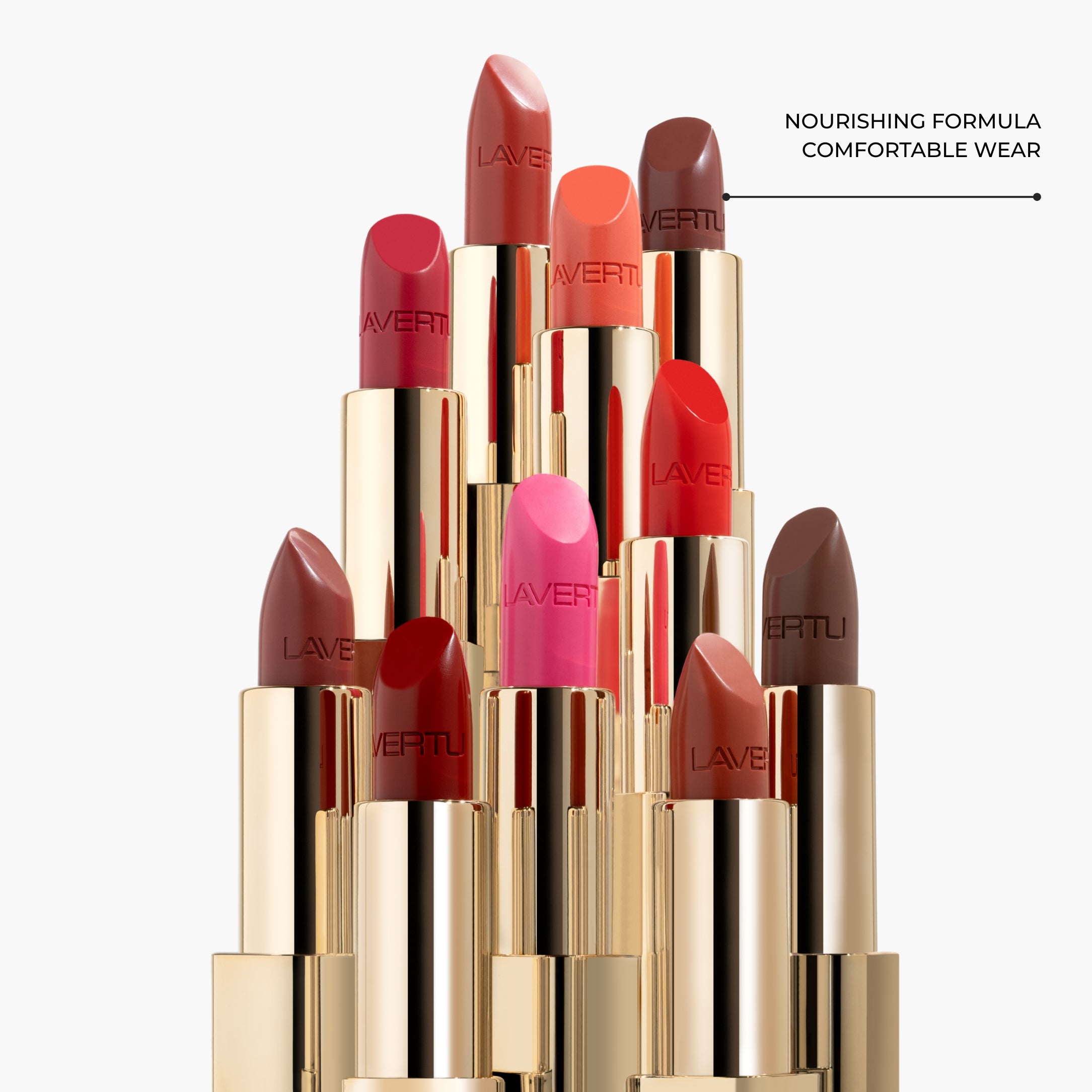 LAVERTU Lipstick Nature collection displayed in an elegant vertical arrangement, showing multiple natural shades including soft nude, rose, coral, berry and classic red, with a nourishing demi matte finish and a luxurious, refined look