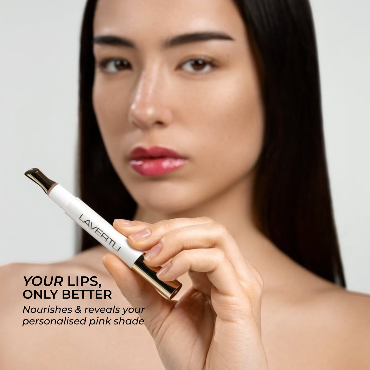 Model with Lavertu Renewal Adaptive Lip Oil and naturally glossy lips with a personalized pink tint