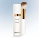 Lavertu Colour Adapting Foundation bottle with vegan makeup brush on light gradient background