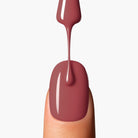 Application close up of LAVERTU Nail Polish Nature 33 Sutter’s Brown showing a smooth warm brown shade with subtle rose undertones and a high-gloss finish on the nail.