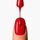 Application close-up of LAVERTU Nail Polish Nature 35 Delbard Orange showing a warm vibrant orange shade with smooth, even coverage and a high-gloss finish on the nail.