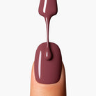 Application close-up of LAVERTU Nail Polish Nature 41 Nude showing smooth, even coverage in a warm nude brown-pink tone with high-gloss finish on the nail.