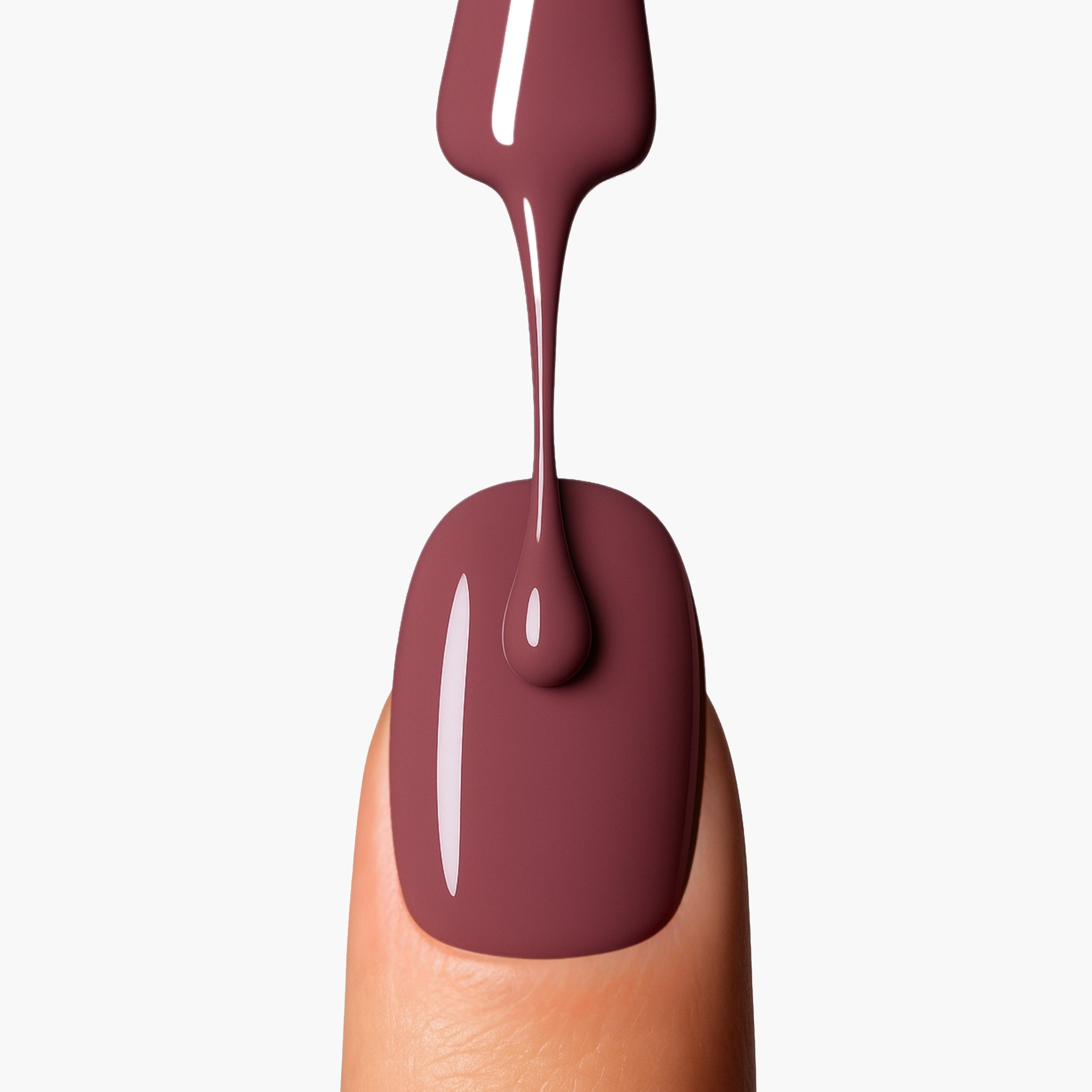 Application close-up of LAVERTU Nail Polish Nature 41 Nude showing smooth, even coverage in a warm nude brown-pink tone with high-gloss finish on the nail.