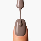 Application close-up of LAVERTU Nail Polish Nature 43 Brunette showing a warm taupe brown colour with neutral undertones, smooth application and glossy, even coverage.