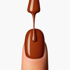 LAVERTU Nail Polish Unique 24 Deneb Brown application showing a warm bronze brown nail colour with subtle metallic shimmer smooth application and glossy finish on the nail.