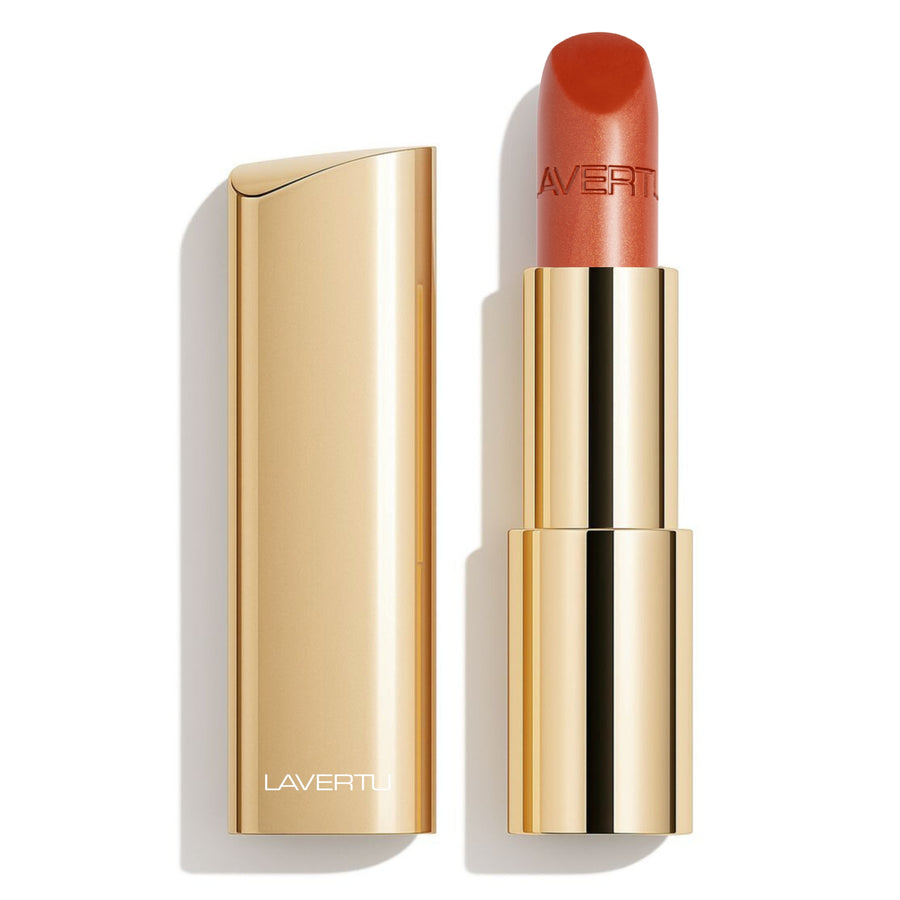 LAVERTU Lipstick Unique 24 Deneb Brown packshot featuring a warm medium brown shade with soft caramel undertones and a subtle metallic bronze sheen, offering full coverage in a luxurious gold case with a smooth matte finish.