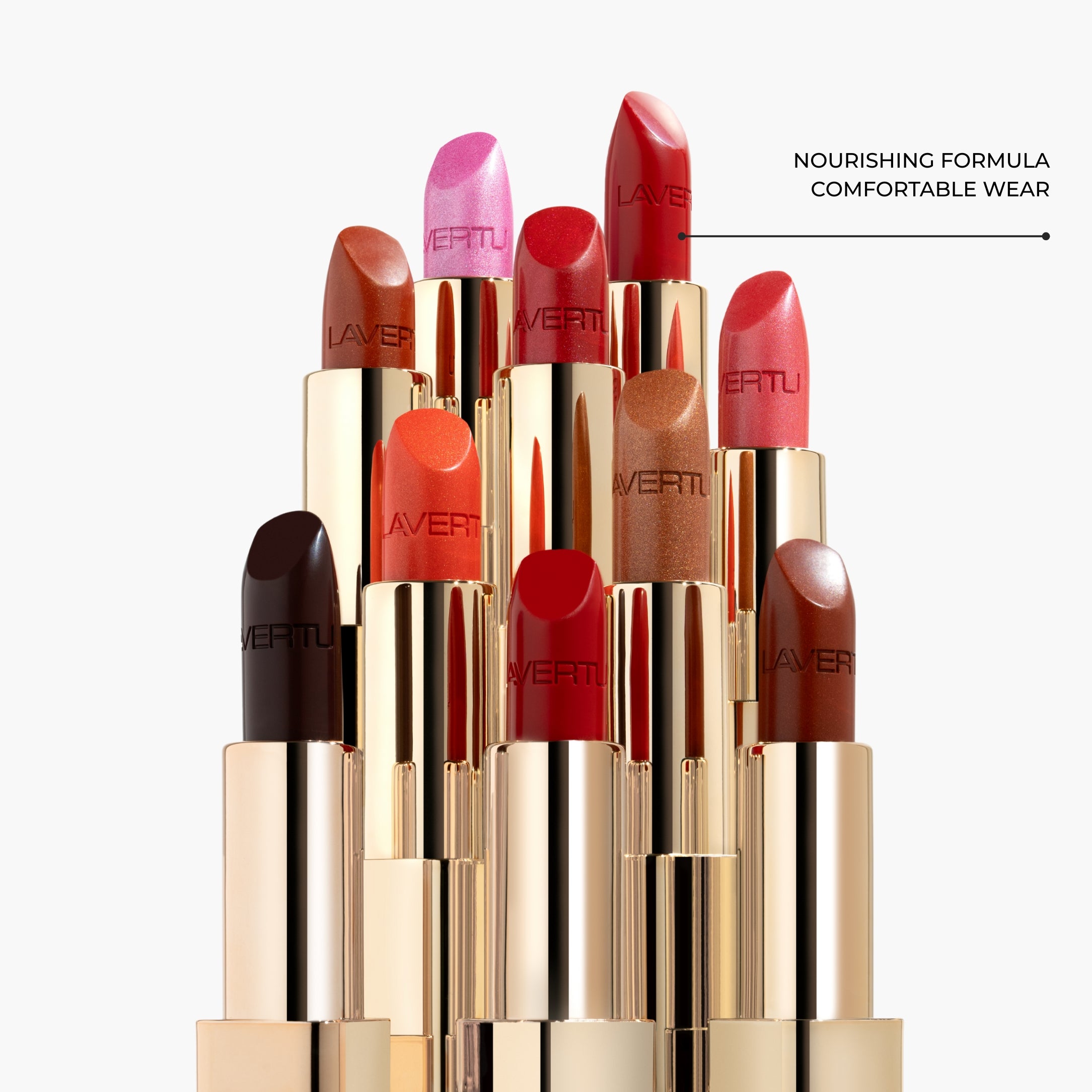 LAVERTU Lipstick Unique collection displayed in an elegant vertical arrangement, showcasing bold shades including nude, rose, coral, berry, brown and classic red, with a full coverage matte finish and a powerful, luxurious look
